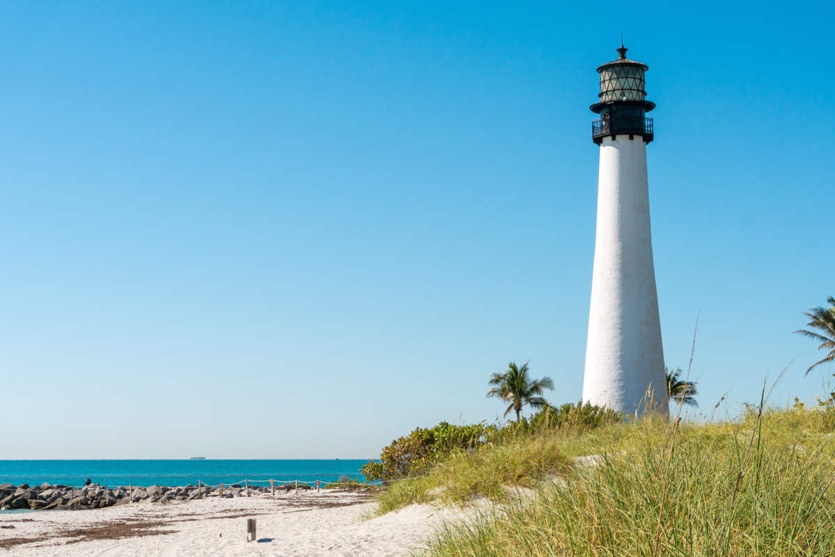The Cape Florida Lighthouse at Bill Baggs State Park, the oldest standing structure in Miami-Dade County, in clear daylight